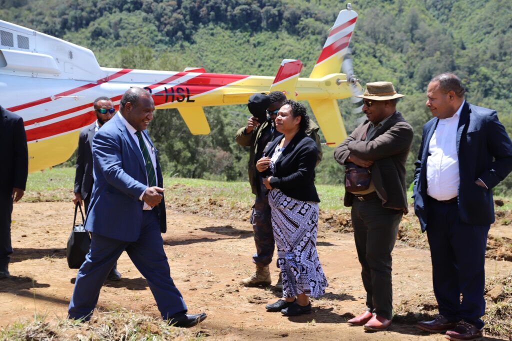 Prime Minister Hon. James Marape arriving as his wife Rachael Marape, Memeber for Koroba-Lake Kopiago Hon. William Bando and Hela Governor Philip Undialu look on.